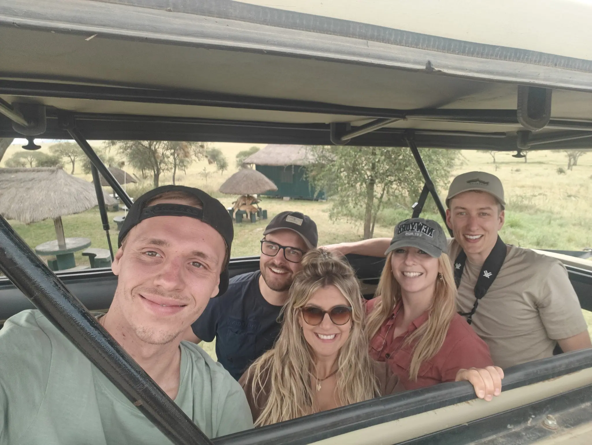 group of friends on a safari game drive in Tanzania