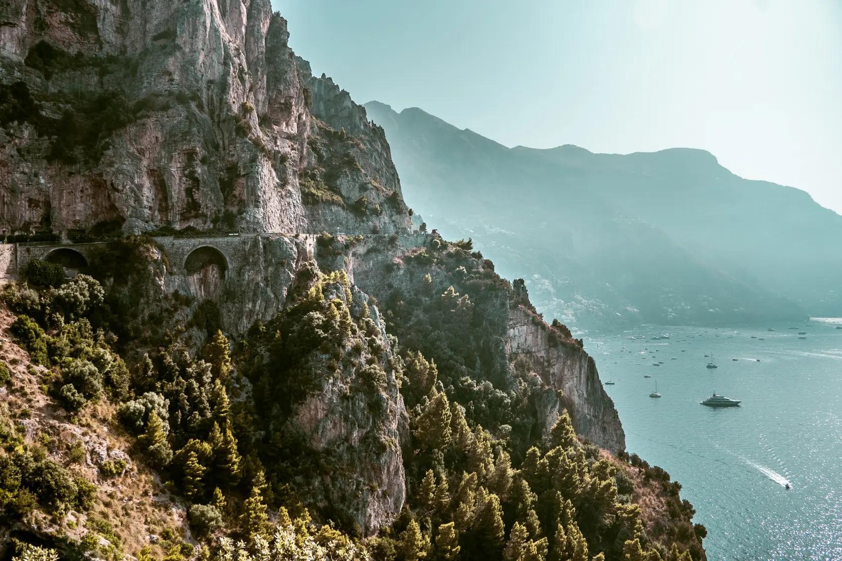Amalfi Coast cliffside road with arches overlooking the sea