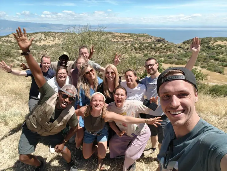 group of happy travelers taking a selfie in Tanzania