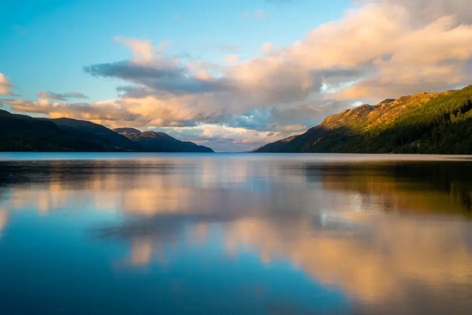 Loch Ness at sunset with reflections of clouds on the water