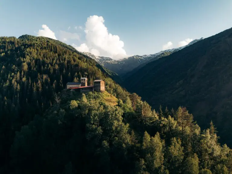 ancient stone towers on a forested mountain in Georgia