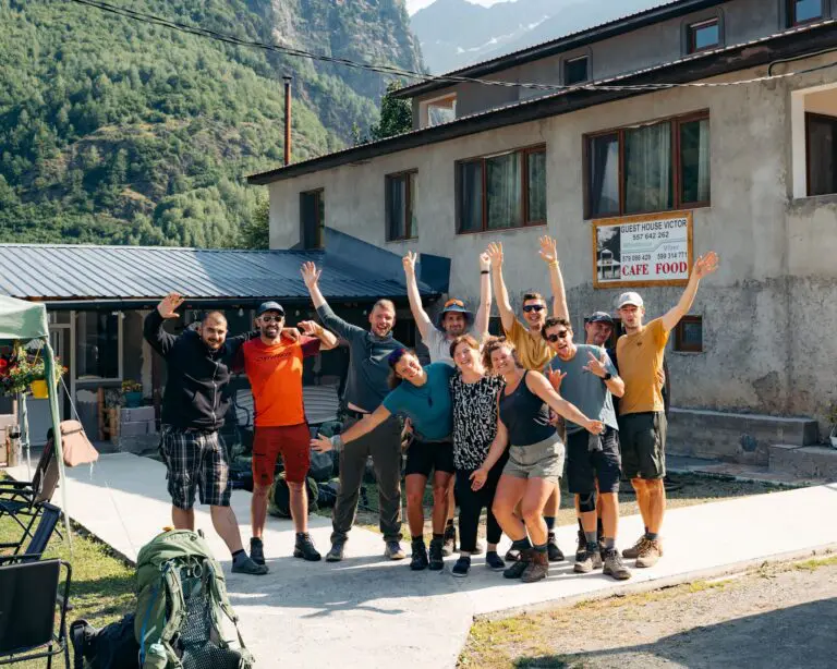 group of hikers waving in front of Guest House Victor in Georgia