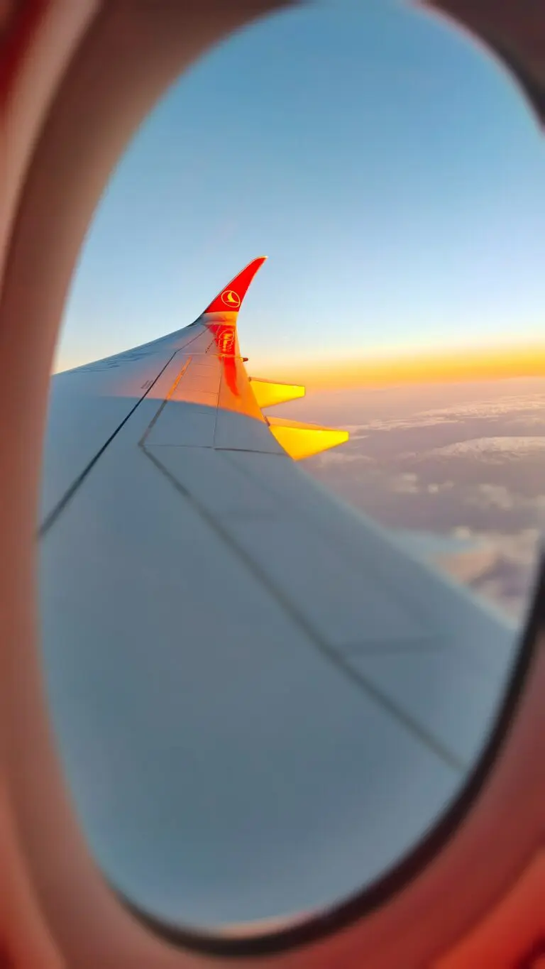 airplane wing at sunset from window