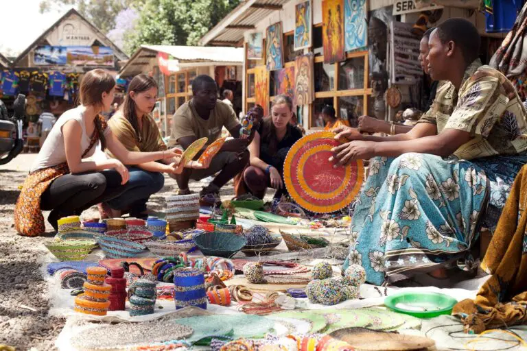 tourists shopping for crafts at a vibrant market in Mto wa Mbu